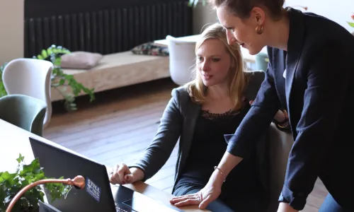 Two business women reviewing ideas — free license by Cowomen from Unsplash.com